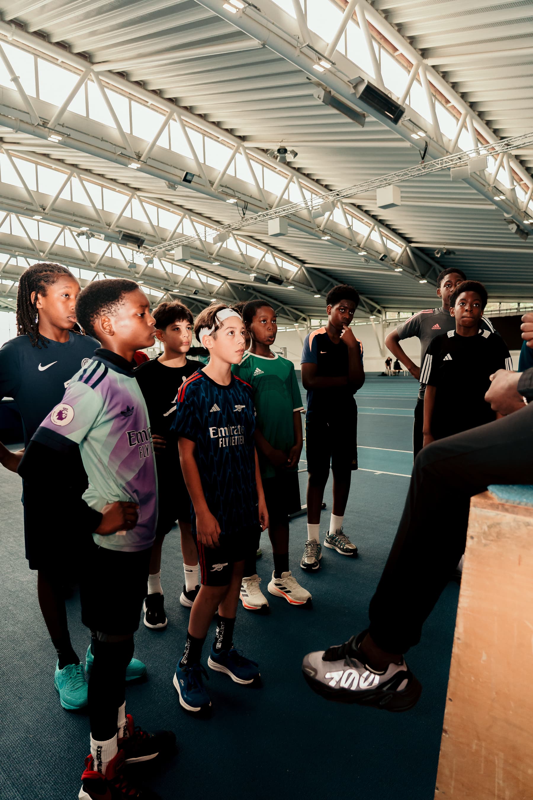 Group of children playing football together in North London